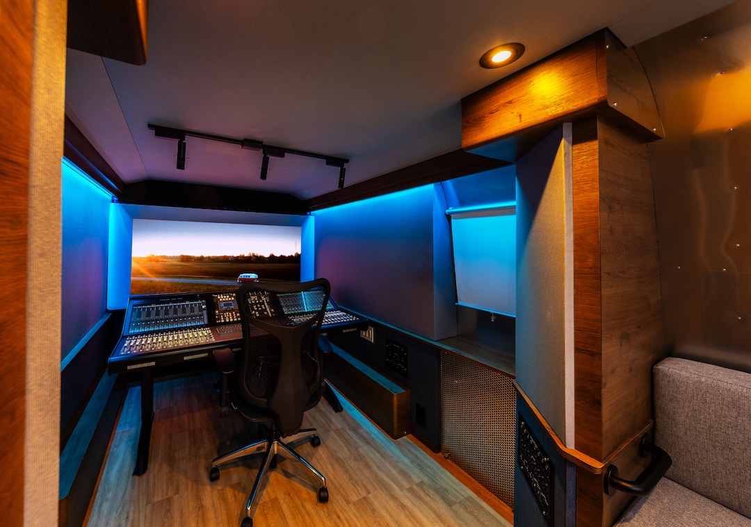 The compact yet comfortable control room, featuring an SSL System T console and 7.1.4 PMC monitor system, viewed from a seating area at the rear. Photo: Matthew Owen